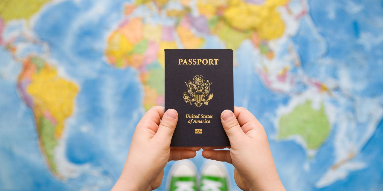 Child Holding Passport; Courtesy of goodmoments/Shutterstock.com