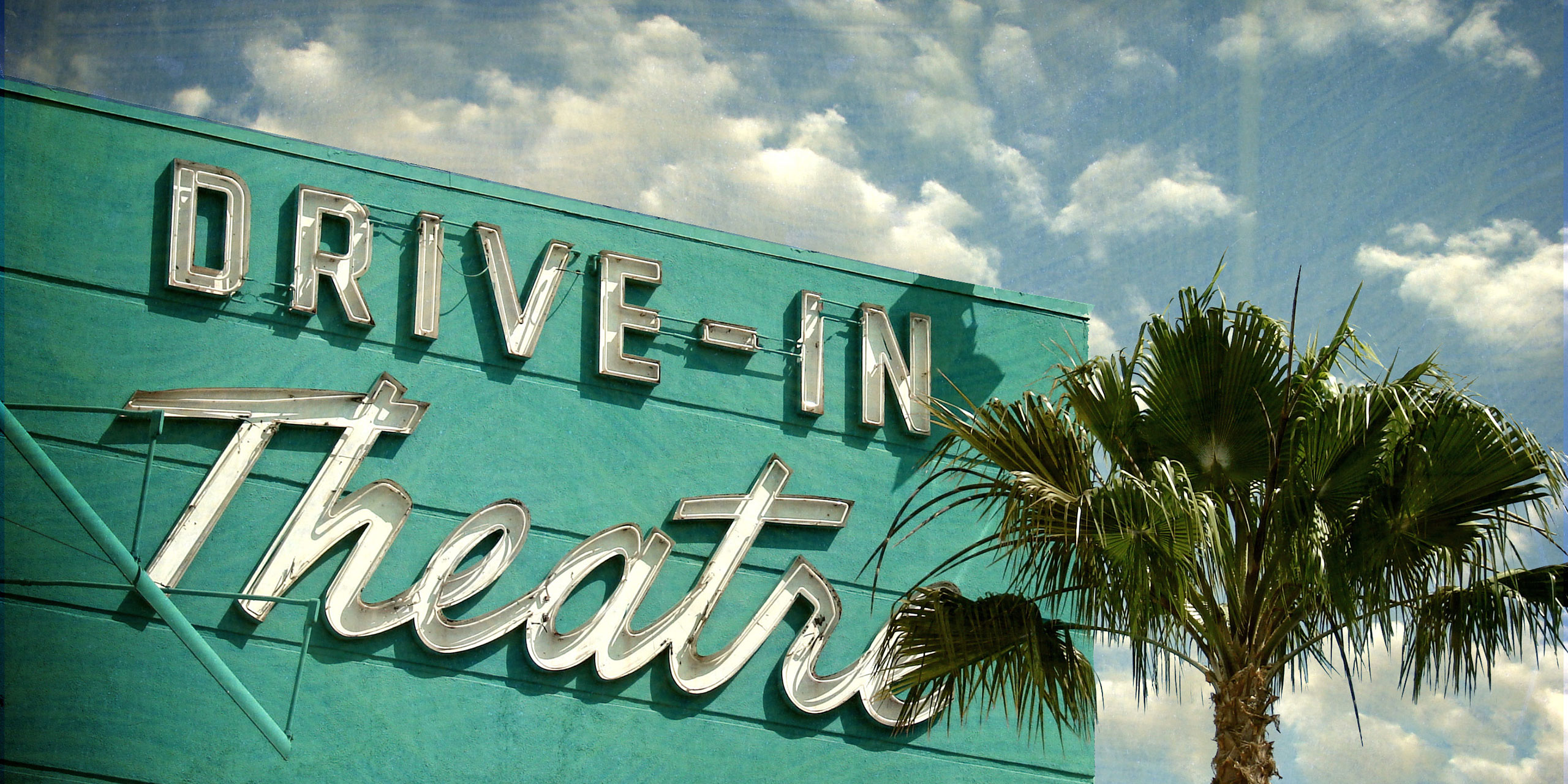 Drive-In Movie Theater Sign; Courtesy of J.D.S/Shutterstock.com