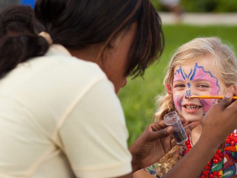 Nanny Painting Young Girl's Face at Beaches Resorts; Courtesy of Beaches Resorts