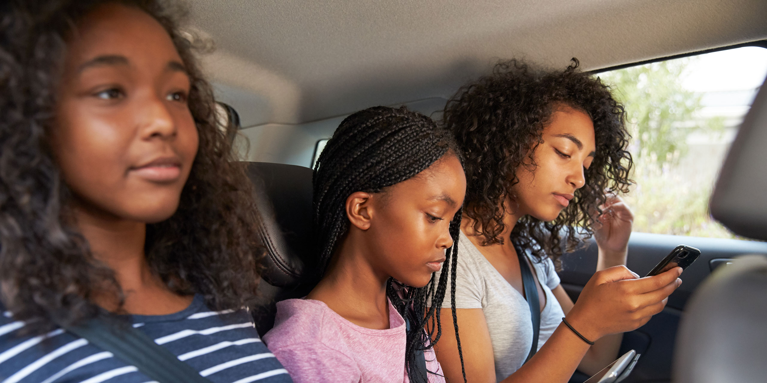 Teen Girls on Road Trip; Courtesy of Monkey Business Images/Shutterstock.com