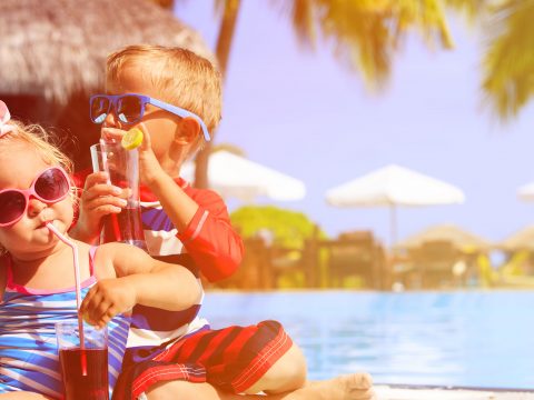 Kids by the Pool; Courtesy of NadyaEugene/Shutterstock.com