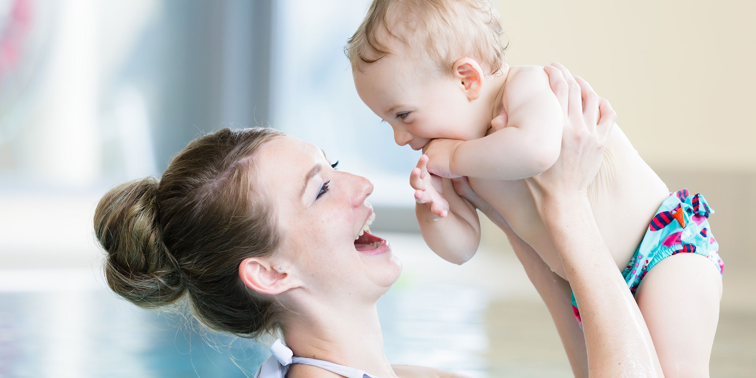 Mom with Baby in Pool; Courtesy of Kzenon/Shutterstock.com