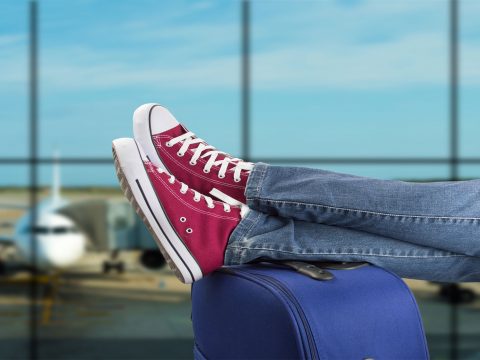 TravelSneakers; Courtesy of cunaplus/Shutterstock.com