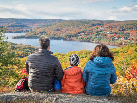 Family Overlooking a Lake in the Fall; Courtesy of Romiana Lee/Shutterstock.com