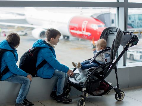 Kids with Stroller at Airport; Courtesy of Tomsickova Tatyana/Shutterstock.com