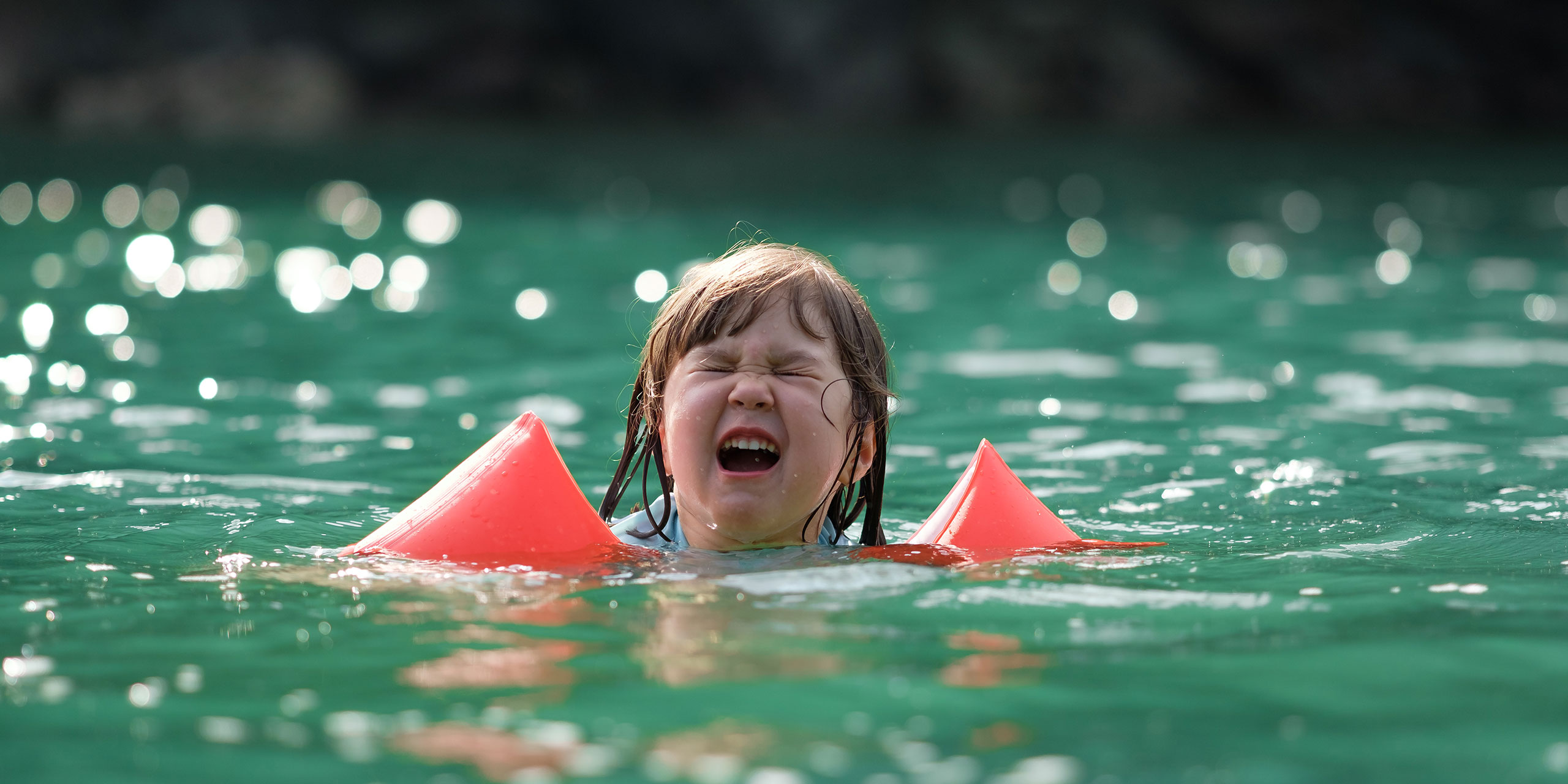 Crying Girl in Pool; Benoist/Shutterstock.com