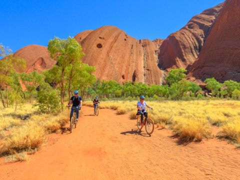 family discovery Ayers Rock with Outback Cycling Ride along Uluru Base Walk in Uluru-Kata Tjuta National Park; Courtesy of Benny Marty/Shutterstock