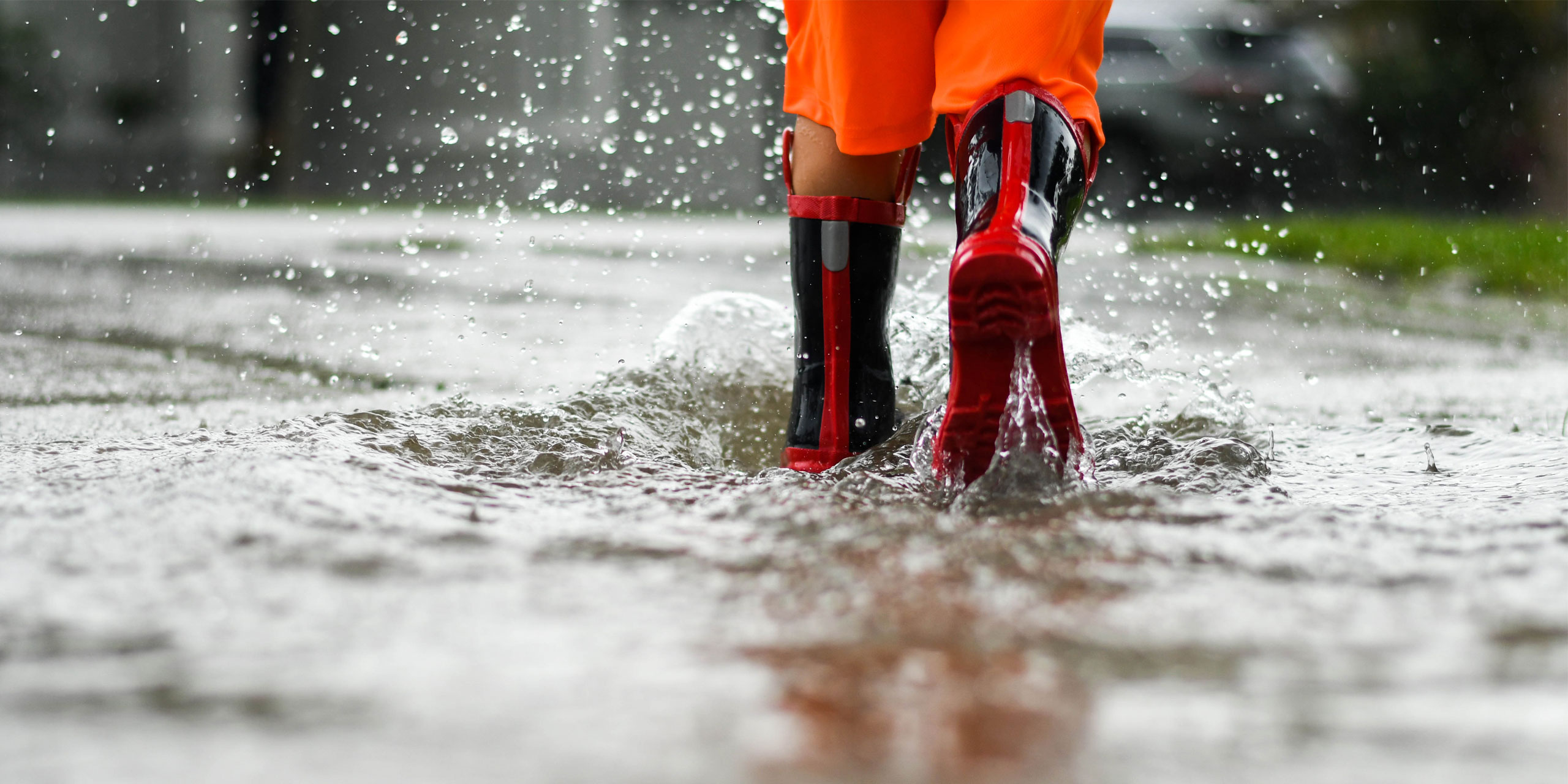 Rainboots In Rain Puddle; Courtesy of Joy Youell/Shutterstock.com