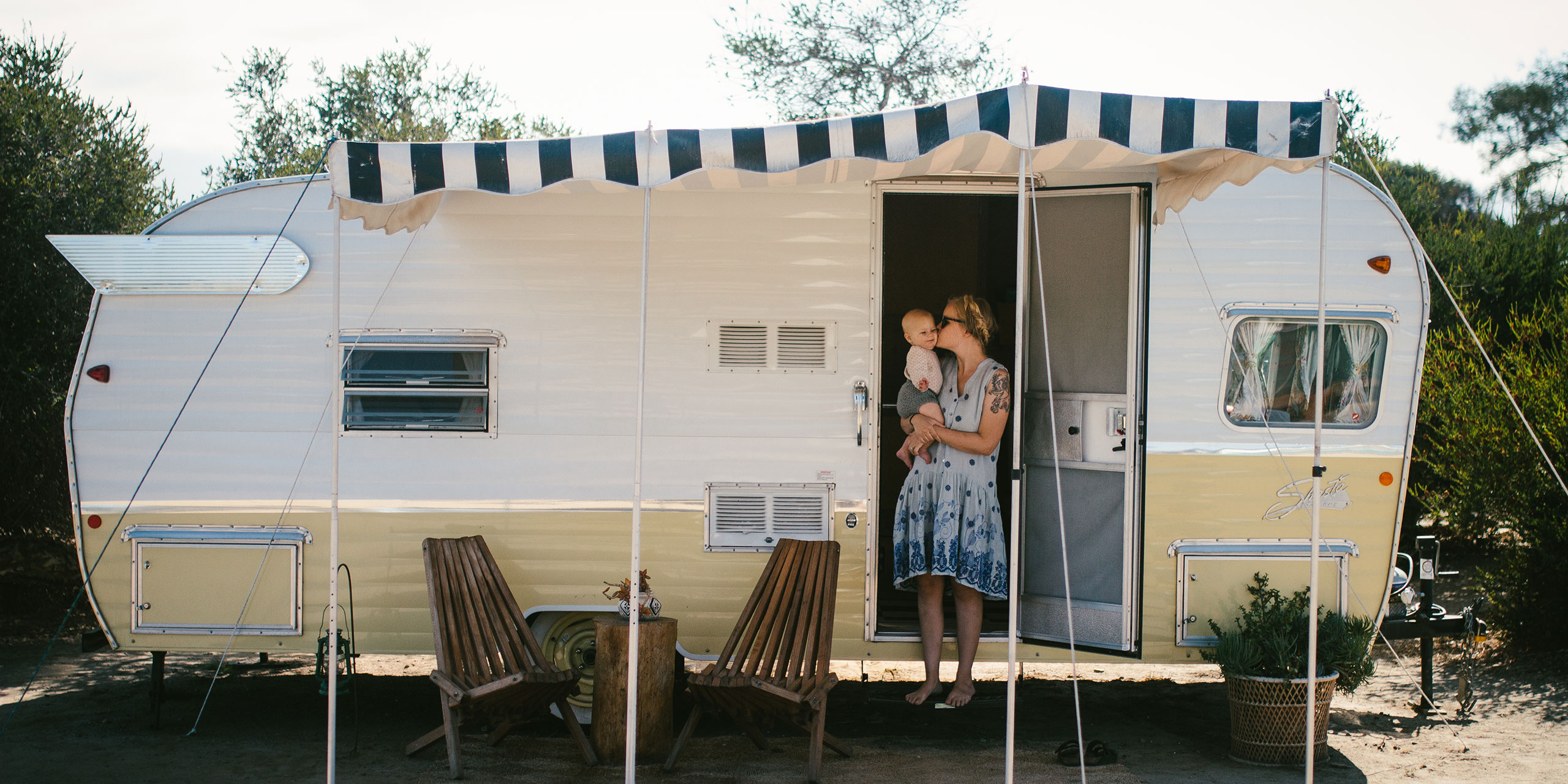 Mom and Baby in Front of Airstream Trailer at The Holidays Camp Community in San Clemente, California; Courtesy of Rebecca Kent