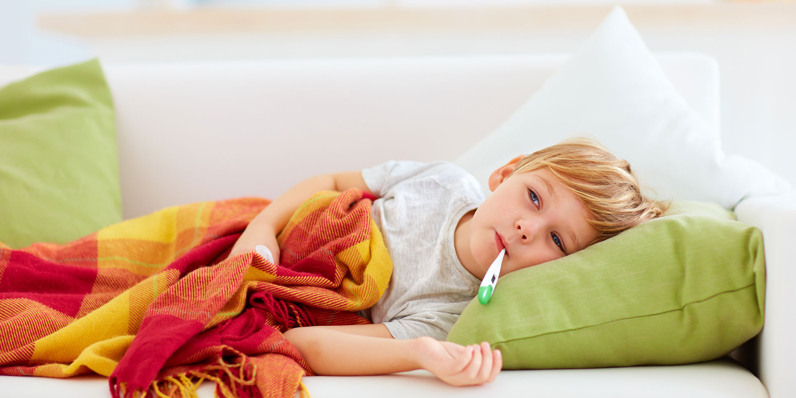 Sick Child on Sofa; Courtesy of Olesia Bilke/Shutterstock.com