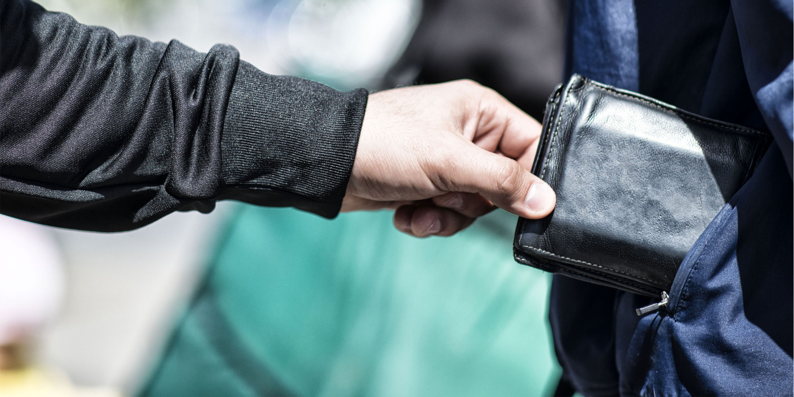 Thieve pickpocketing wallet; Courtesy of DDekk/Shutterstock.com
