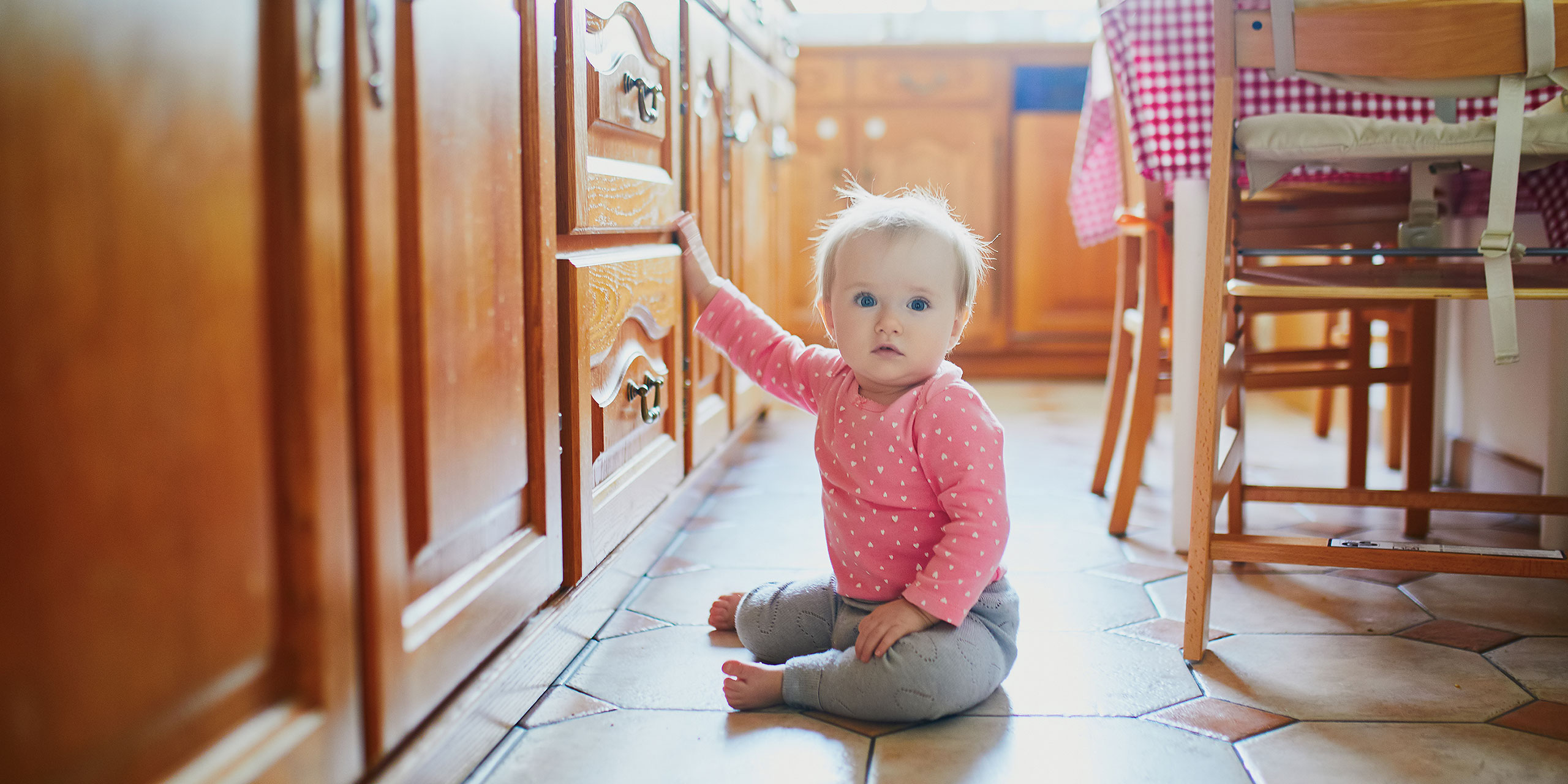 Toddler on Floor in Kitchen; Courtesy of Ekaterina Pokrovsky/Shutterstock.com