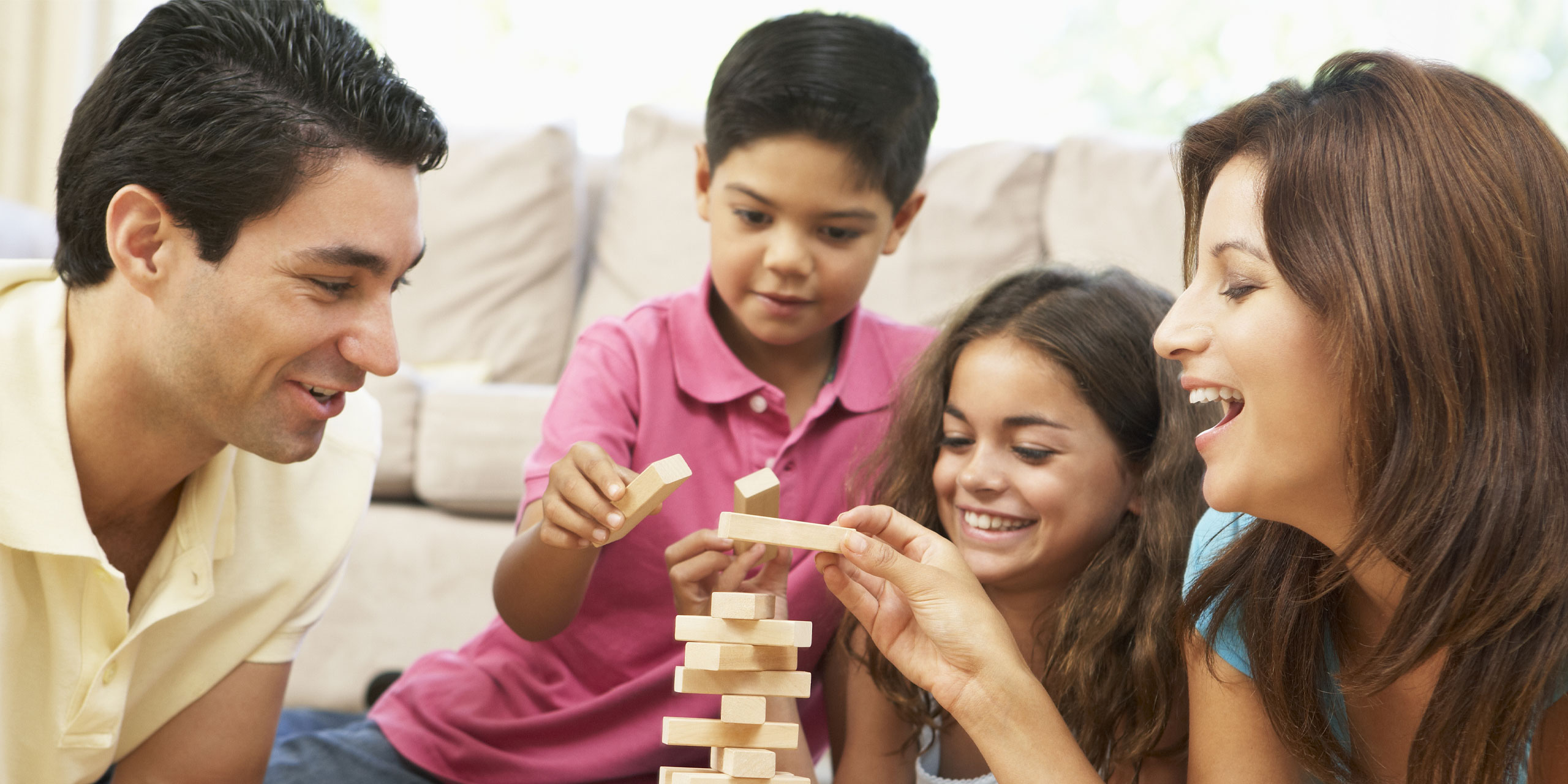 Family Playing Game; Courtesy of Monkey Business Images/Shutterstock.com
