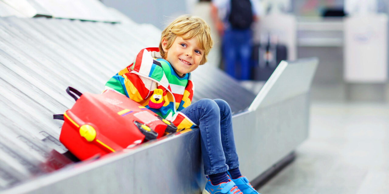 boy on baggage belt; Courtesy of Shutterstock