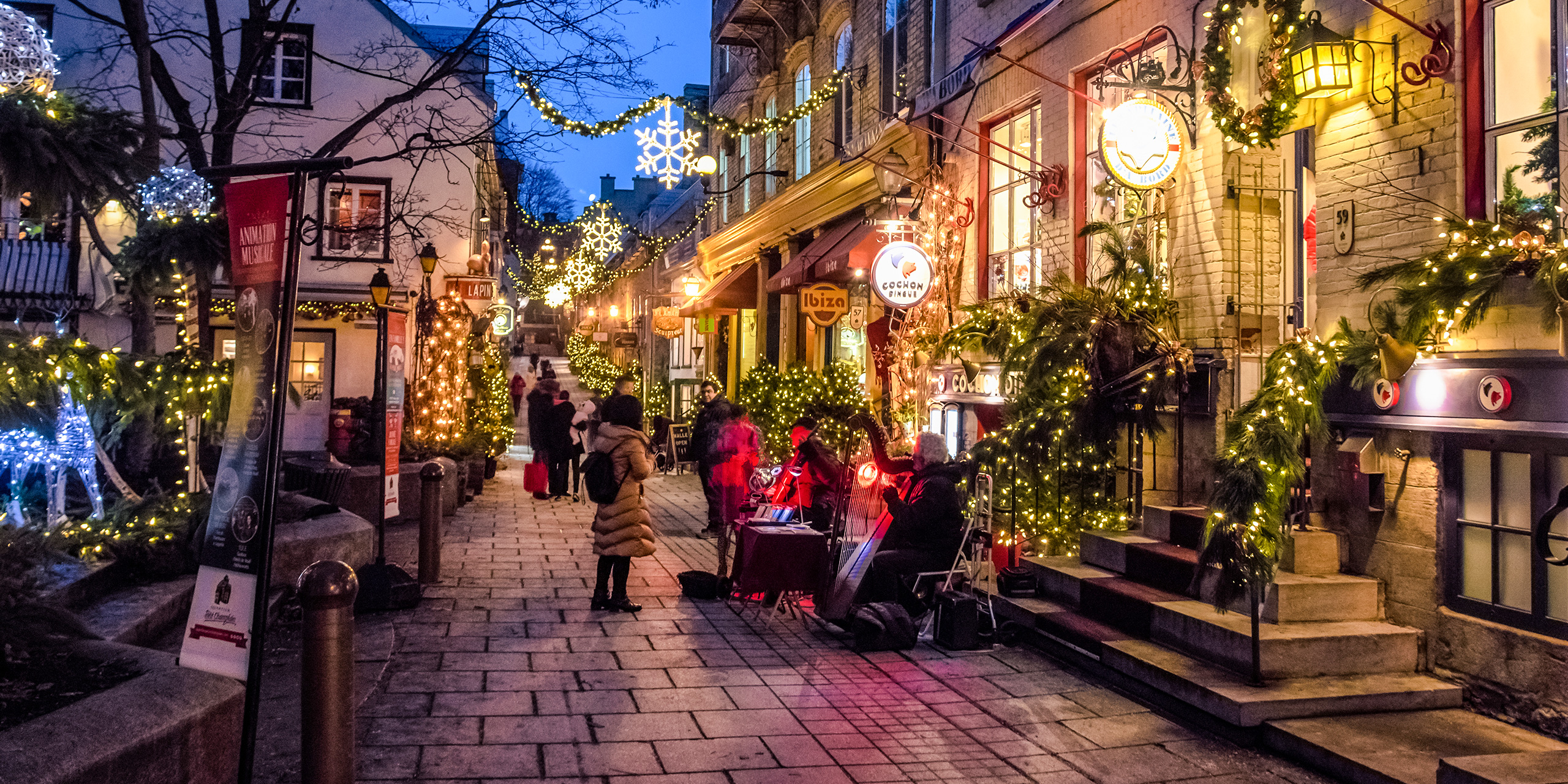 quebec city montreal holiday street; Courtesy of By AnjelikaGr/Shutterstock