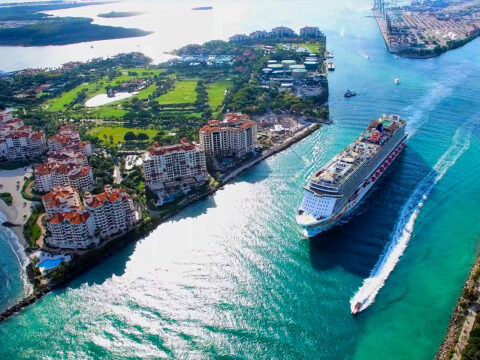 Cruise ship enter to Atlantic ocean from Government Cut canal. ; Courtesy Mia2You/Shutterstock